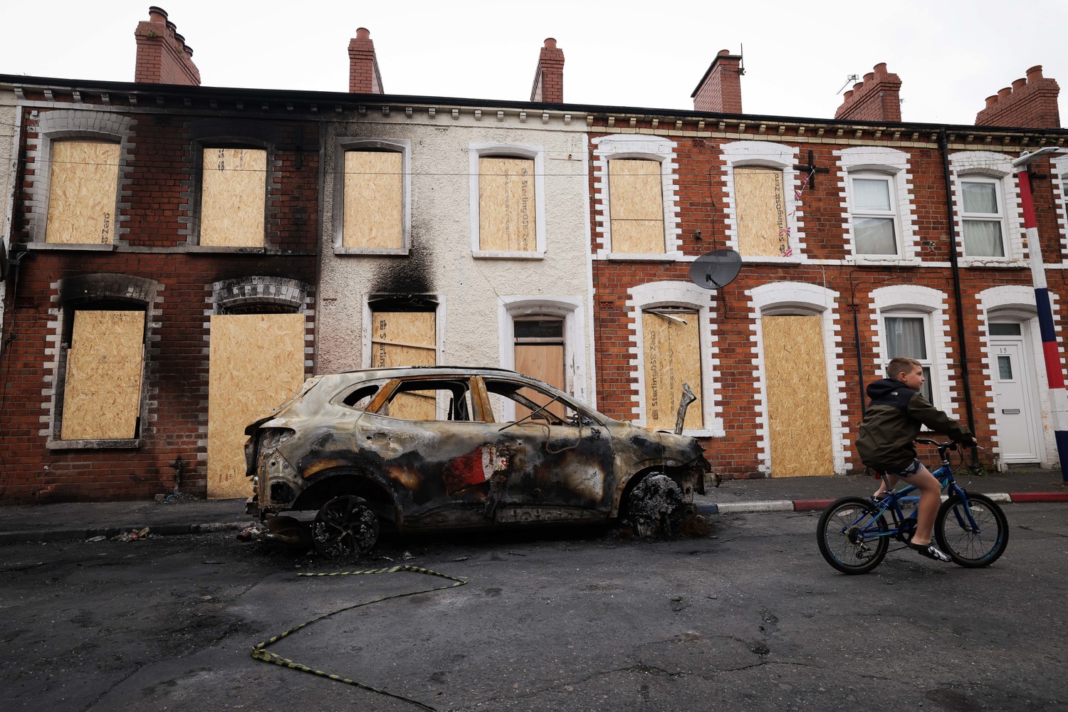 Cars remain abandoned and houses boarded up in Lendrick Street in East Belfast after they were attacked last week. Photo by Kelvin Boyes, Press Eye Cars remain abandoned and houses boarded up in Lendrick Street in East Belfast after they were attacked last week. Photo by Kelvin Boyes, Press Eye