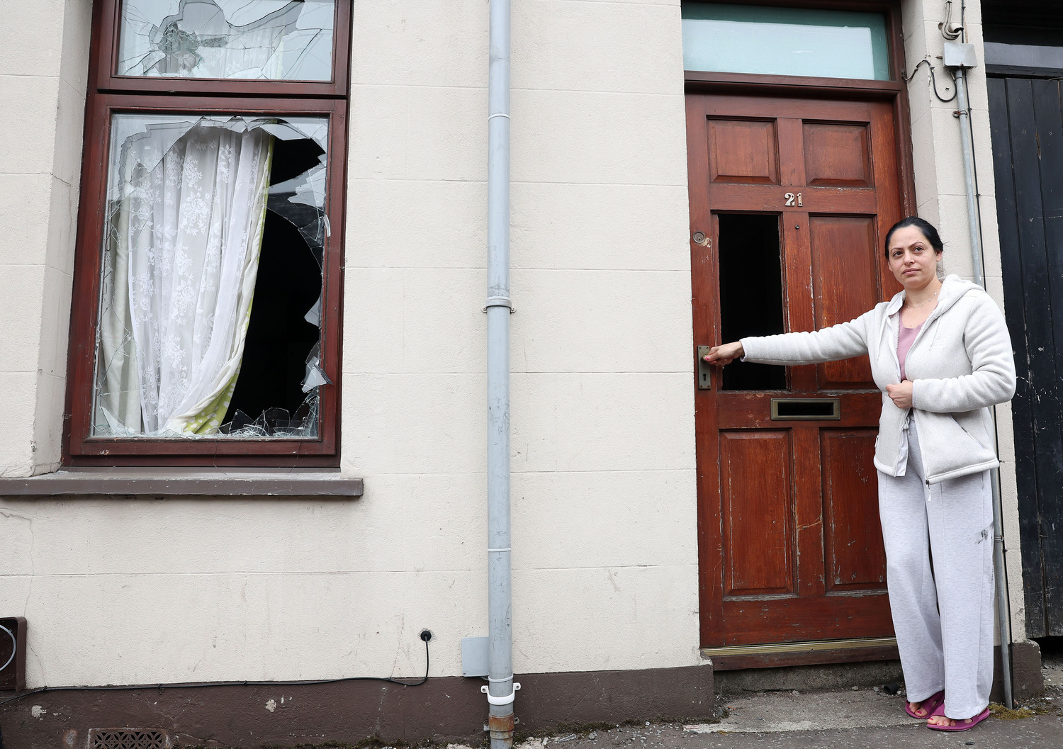 Minka Kolev outside her home, which was attacked and ransacked during the racist violence in Ballymena in July 2025. Photo by Jonathan Porter, Press Eye Minka Kolev outside her home, which was attacked and ransacked during the racist violence in Ballymena in July 2025. Photo by Jonathan Porter, Press Eye