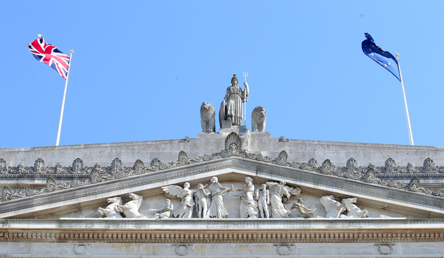 A UK and EU flag over Stormont